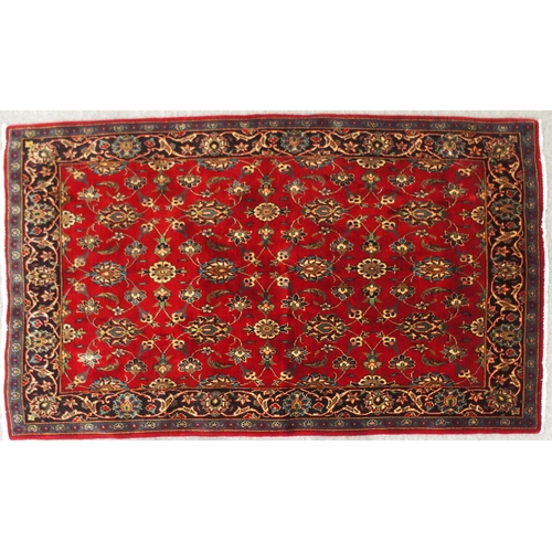 2139 - A RED GROUND TABRIZ RUGwith all-over floral design and dark blue flower head border, 166cm long x 99... 