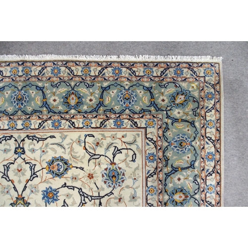 2140 - A CREAM GROUND KASHAN RUGwith all-over floral design and flower head border, 361cm long x 242cm wide... 