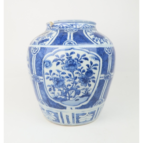 2354 - A CHINESE 'KRAAK' PORCELAIN BROAD JAR Painted with panels of flowers within a key pattern ground, di... 