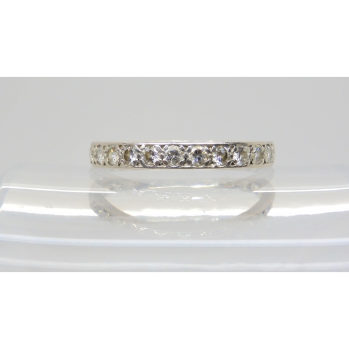 2704 - A WHITE METAL FULL DIAMOND ETERNITY RINGset with estimated approx 1.30cts of brilliant cut diamonds,... 