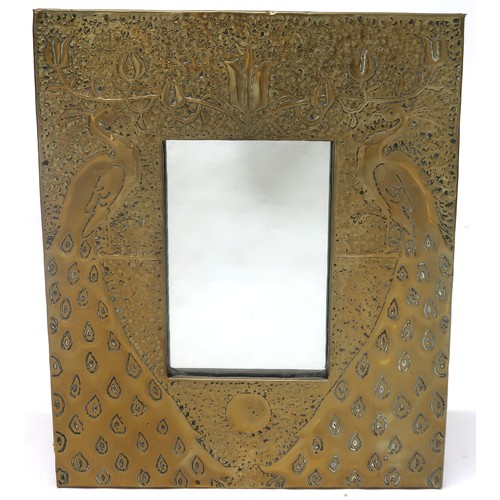 2040 - AN EARLY 20TH ARTS & CRAFTS AFTER TALWIN MORRIS WALL MIRRORwith hammered brass frame depicting t... 