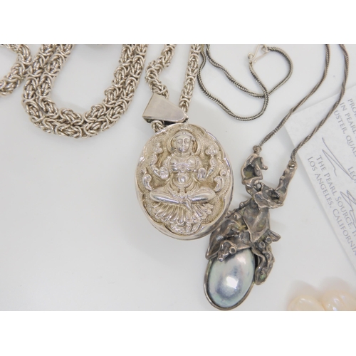 933 - An Indian white metal double sided locket embossed with goddesses, on an Italian made continental si... 