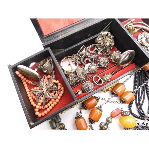 915 - A string of coral beads weight 20.4gms, a white metal Art Nouveau buckle, and other items of silver ... 