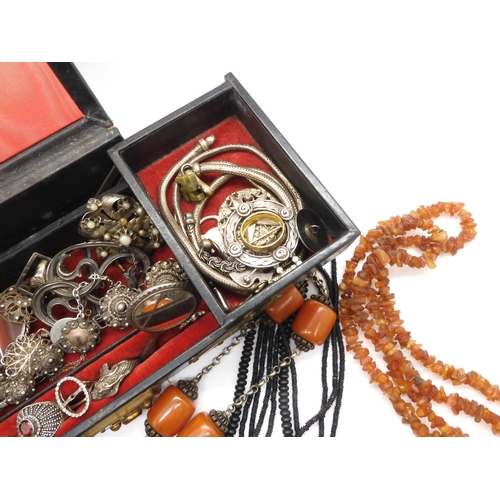 915 - A string of coral beads weight 20.4gms, a white metal Art Nouveau buckle, and other items of silver ... 