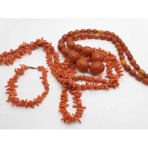 925 - A string of amber coloured beads, largest bead 2.4cm x 1.8cm, weight 63.9gms, together  with a ... 