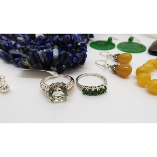 929 - A honey jade necklace and earrings, a Russian diopside silver snake ring, a lapis lazuli, necklace a... 