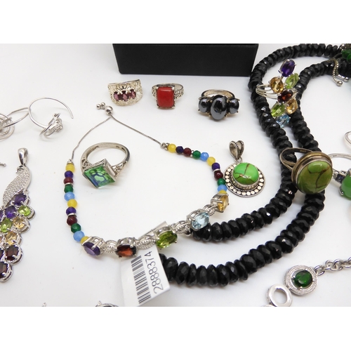 931 - An onyx and mother of pearl Strada watch, a Russian diopside large bead necklace, a Peacock quartz r... 