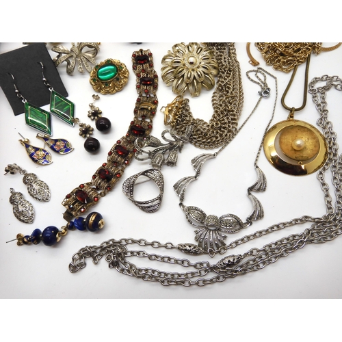 946 - A collection of vintage costume jewellery and watches, to include a Miracle scarf ring, Marcasite it... 