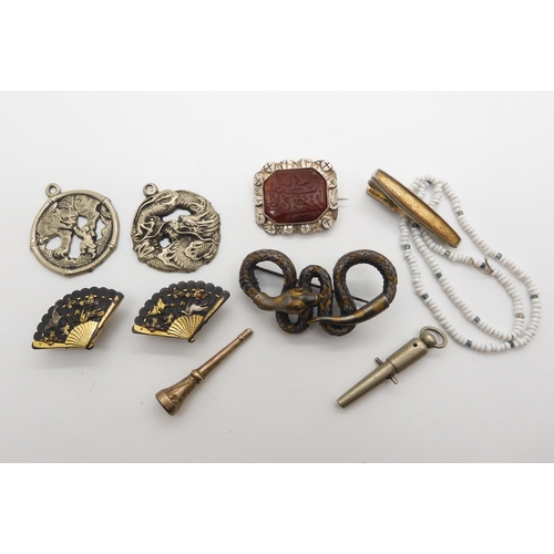 950 - A costume jewellery snake brooch of woven metal construction, a pair of Shakudo fan shaped shirt stu... 