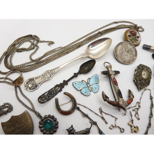 959 - A silver Peruvian coin brooch, dated 1885, a Victorian Glasgow silver spoon, A  white metal dress cl... 