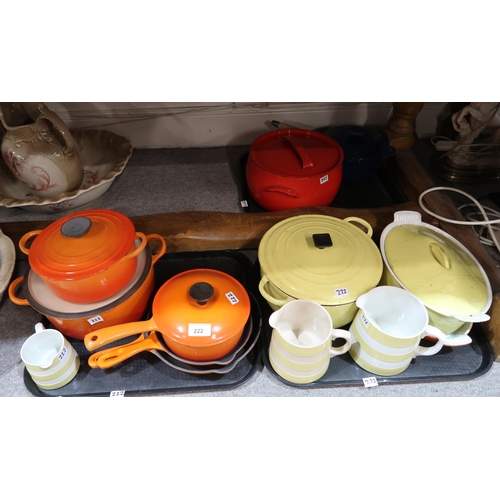 222 - A collection of Le Crueset orange and yellow kitchenware including lidded pots, frying pans etc and ... 