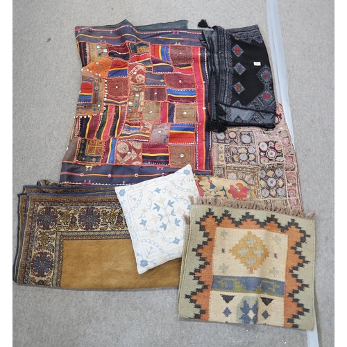 250 - A kelim floor covering, assorted Indian textiles, table coverings etc