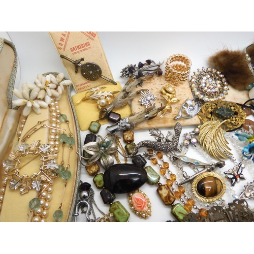 965 - A large collection of vintage costume jewellery, to include deco necklaces, Egyptian revival bracele... 