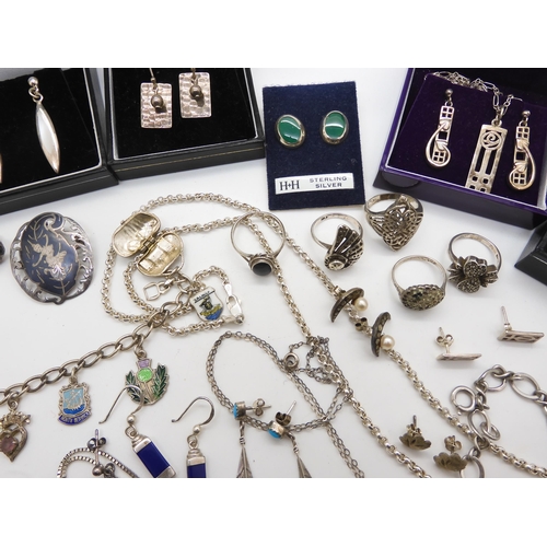 968 - A collection of silver and costume jewellery to include silver Mackintosh style jewellery, a silver ... 