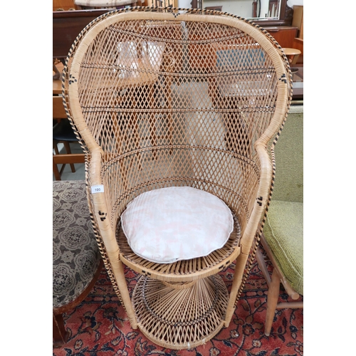 100 - A 20th century wicker conservatory peacock chair, 113cm high