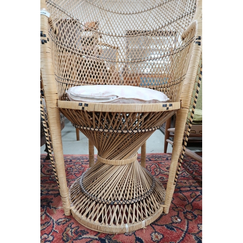 100 - A 20th century wicker conservatory peacock chair, 113cm high