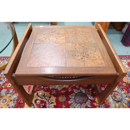 104 - A mid 20th century Scandinavian teak and glass topped circular coffee table, 43cm high x 81cm diamet... 