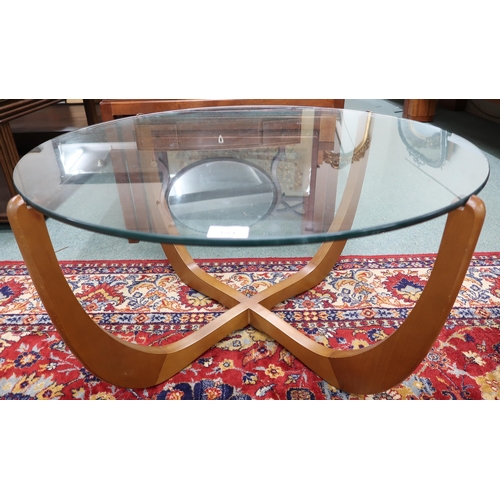 104 - A mid 20th century Scandinavian teak and glass topped circular coffee table, 43cm high x 81cm diamet... 