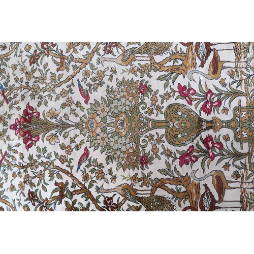 111 - A pair 20th century wool tree of life pattern rugs with floral foliate border, 228cm long x 171cm wi... 