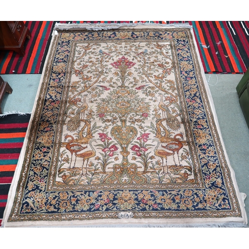 112 - A pair 20th century wool tree of life pattern rugs with floral foliate border, 228cm long x 171cm wi... 