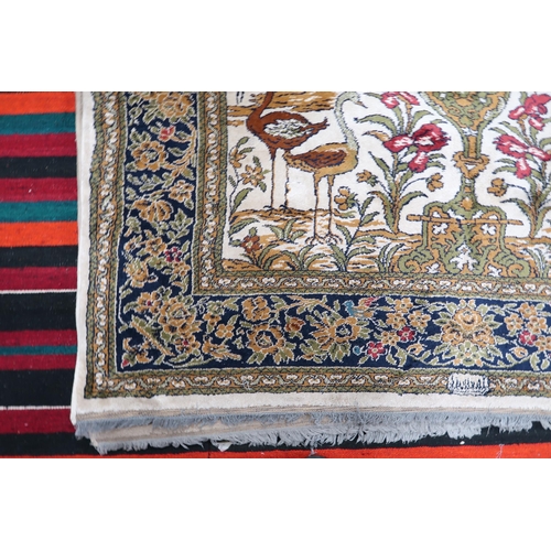 113 - A pair 20th century wool tree of life pattern rugs with floral foliate border, 228cm long x 171cm wi... 