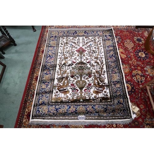 114 - A pair 20th century wool tree of life pattern rugs with floral foliate border, 180cm long x 133cm wi... 