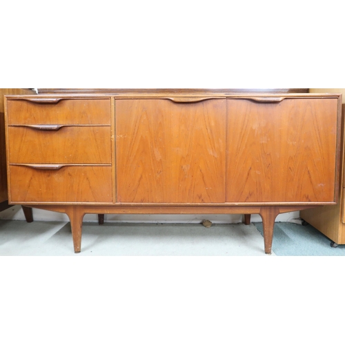 118 - A mid 20th century teak McIntosh of Kirkcaldy sideboard with pair of cabinet doors alongside three d... 