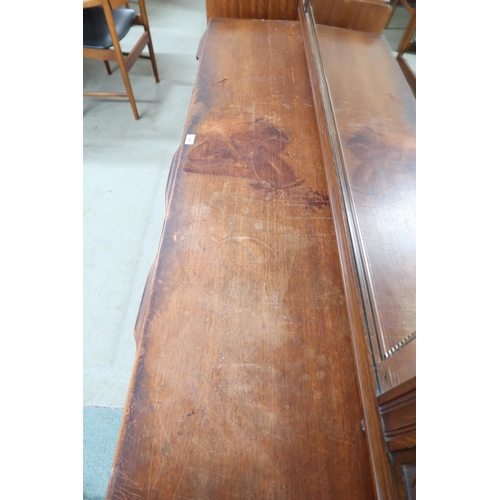 118 - A mid 20th century teak McIntosh of Kirkcaldy sideboard with pair of cabinet doors alongside three d... 