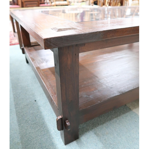 120 - A 20th century Indonesian hardwood Lombok coffee table with glazed inset top, 49cm high x 161cm long... 