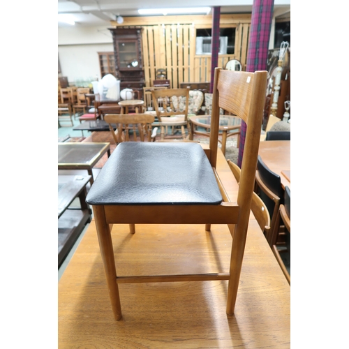 123 - A mid 20th century teak extending dining table and six chairs, dining table with one internal leaf o... 