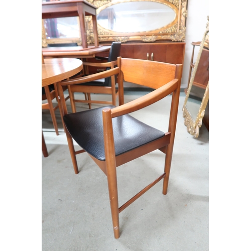 123 - A mid 20th century teak extending dining table and six chairs, dining table with one internal leaf o... 