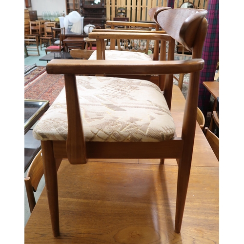 126 - A pair of mid 20th century teak framed dining carvers with velour upholstered seats (2)