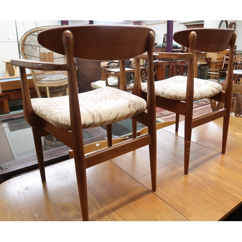 126 - A pair of mid 20th century teak framed dining carvers with velour upholstered seats (2)