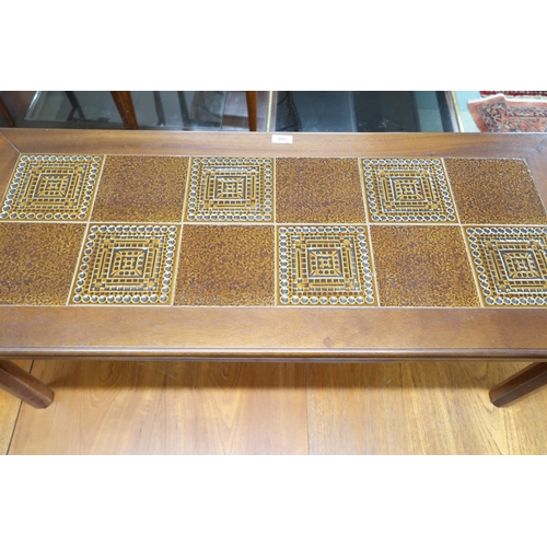 128 - A mid 20th century teak McIntosh nest of three tables on square chamfered supports, 53cm high x 54cm... 