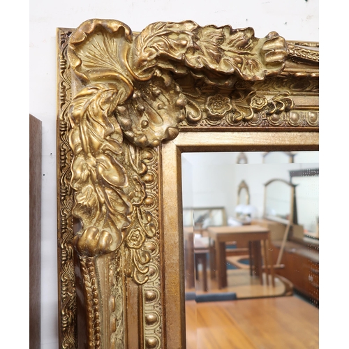 133 - A lot of two 20th century gilt framed Rococo style wall mirrors, first 120cm high x 89cm wide and se... 