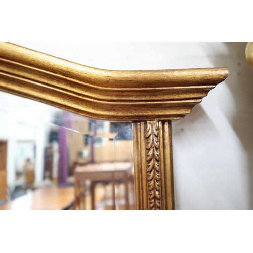 134 - A 20th century gilt framed Rococo style wall mirror, 112cm high x 67cm wide and a gilt framed overma... 