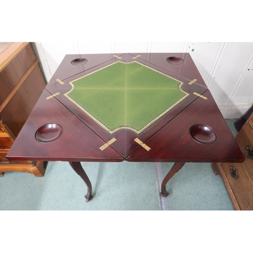 14 - A 20th century mahogany envelope card table with four fold top concealing green baize play surface o... 