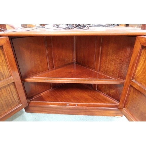 140 - A 20th century Oriental hardwood open corner cabinet with three glass shelves over pair of cabinet d... 