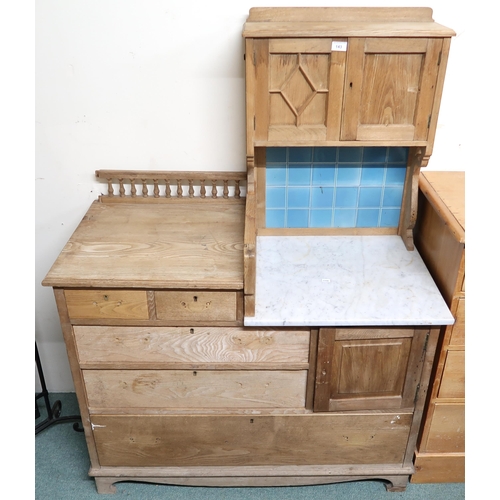 143 - A late Victorian pine wash stand with marble top with tilled splash back, 145cm high x 107cm wide x ... 