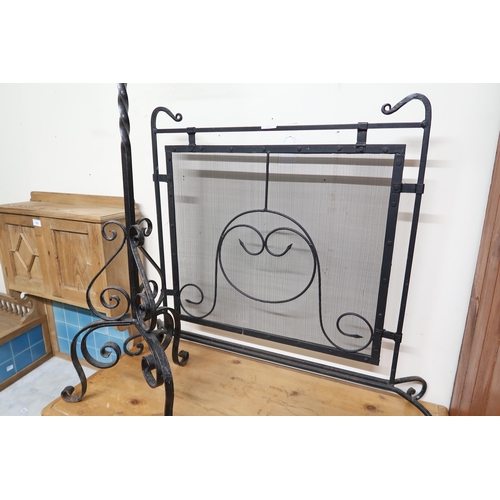 145 - An early 20th century wrought iron Art Nouveau style fire screen and a 20th century Gothic revival l... 