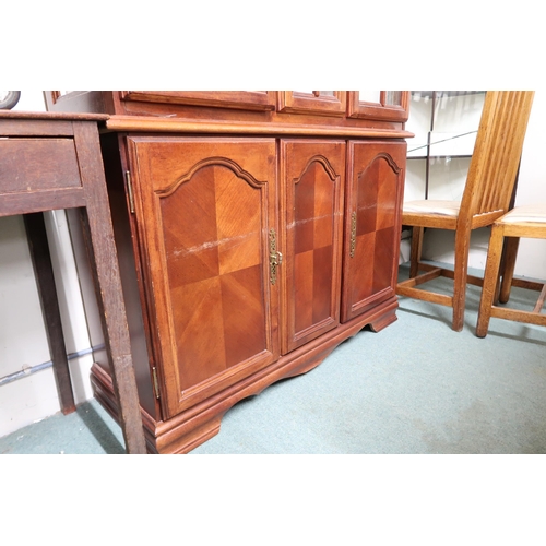 146 - A 20th century mahogany glazed display cabinet with moulded cornice over pair of glazed doors over p... 