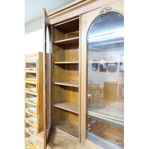 165 - A late Victorian pine library bookcase with moulded cornice over three glazed doors on base with thr... 