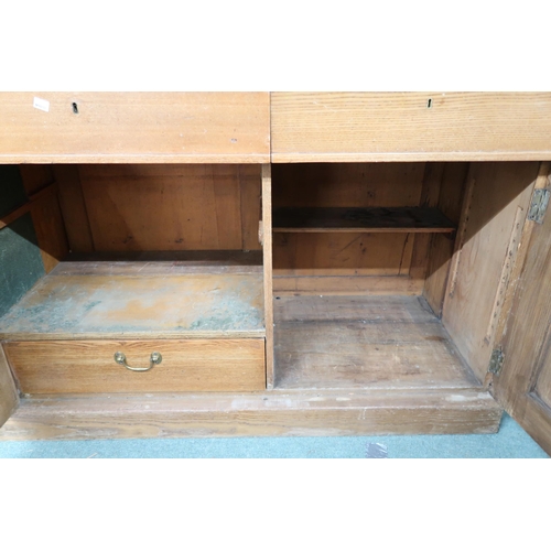 165 - A late Victorian pine library bookcase with moulded cornice over three glazed doors on base with thr... 