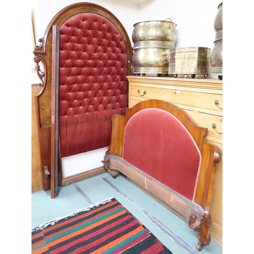 169 - A Victorian walnut bed, head board with red velour buttonback upholstery, 219cm high x 142cm wide x ... 