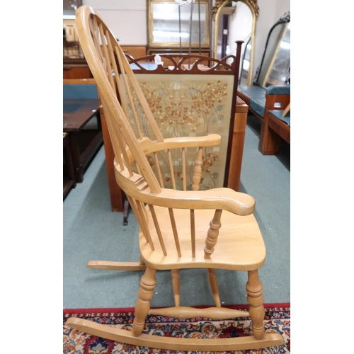 170 - A 20th century pine Windsor style rocking chair, 117cm high