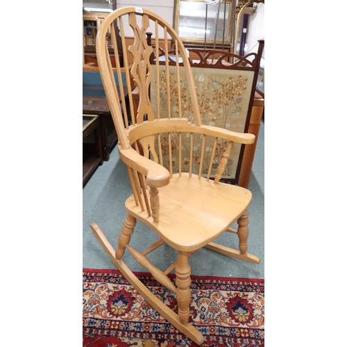 170 - A 20th century pine Windsor style rocking chair, 117cm high