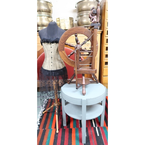 173 - A 20th century treadle spinning wheel, mid 20th century dress makers mannequin and a painted two tie... 