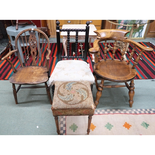 176 - A 20th century elm wheel back armchair, horseshoe back armchair, ebonised bobbin chair and a tapestr... 