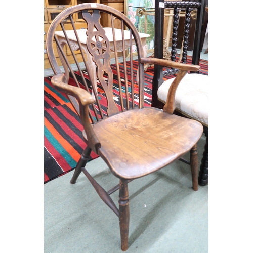 176 - A 20th century elm wheel back armchair, horseshoe back armchair, ebonised bobbin chair and a tapestr... 