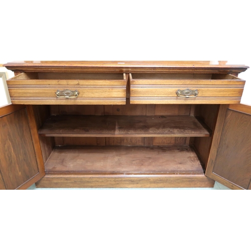 185 - An early 20th century mahogany kitchen dresser with three open shelves over two drawers over pair of... 